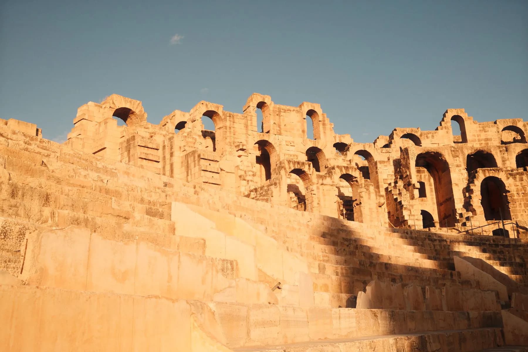 The upper tiers of the amphitheatre of El Jem in the late afternoon light